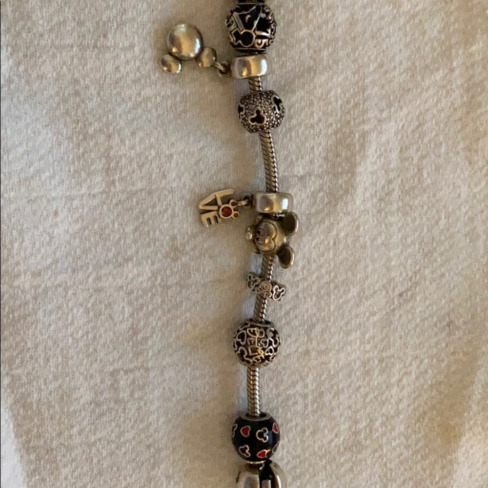 Pandora bracelet with retired Disney charms